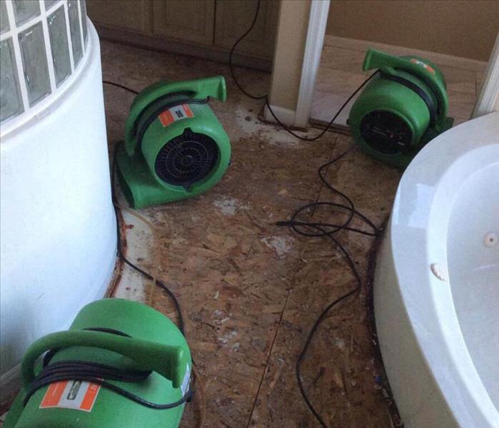 drying equipment set strategically to dry the water damaged master bathroom