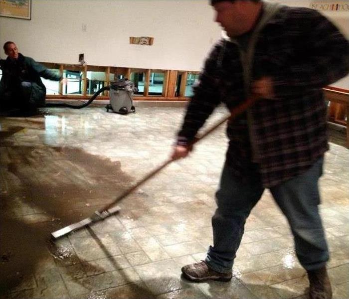 Specialist is cleaning a water damage in a property